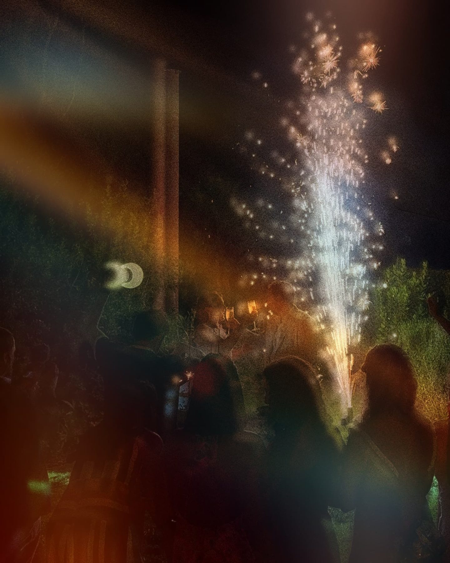 Cold sparks lighting up the night at a party